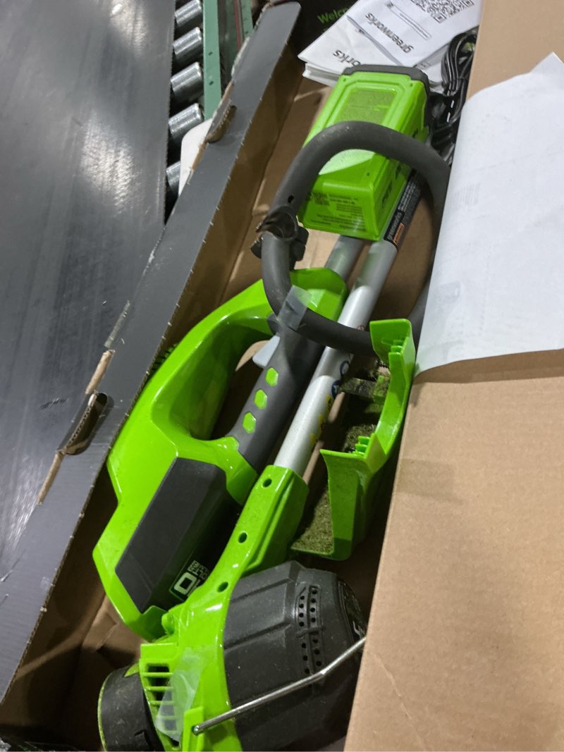 Condition photo showing As Is for greenworks 40v 12  string trimmer with 2.0 ah battery & charger 2101602