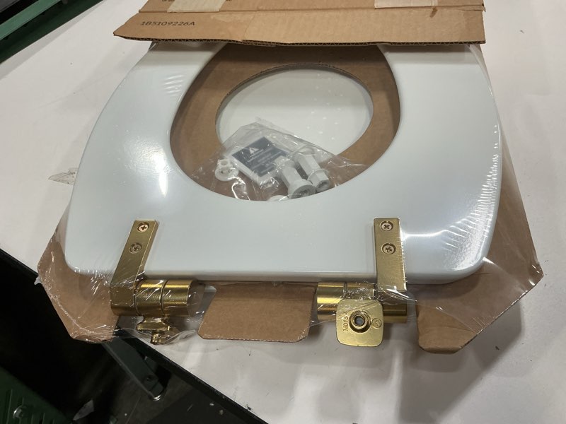 Condition photo showing Good Condition for mayfair bennett toilet seat with brushed gold hinges, slow close wood seat, secure metal hinges, easy install, made in usa, elongated, white elongated gold