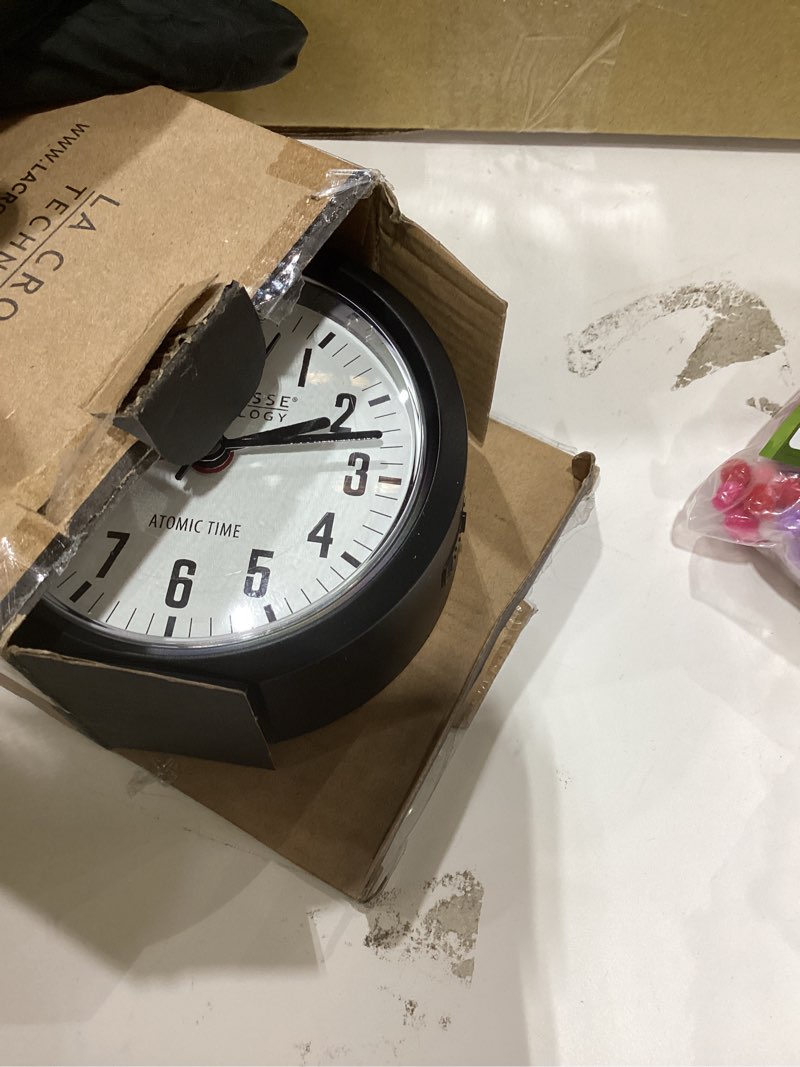 Condition photo showing Good Condition for La Crosse Technology 617-710B-INT 4-Inch Round Black Atomic Analog Alarm Clock