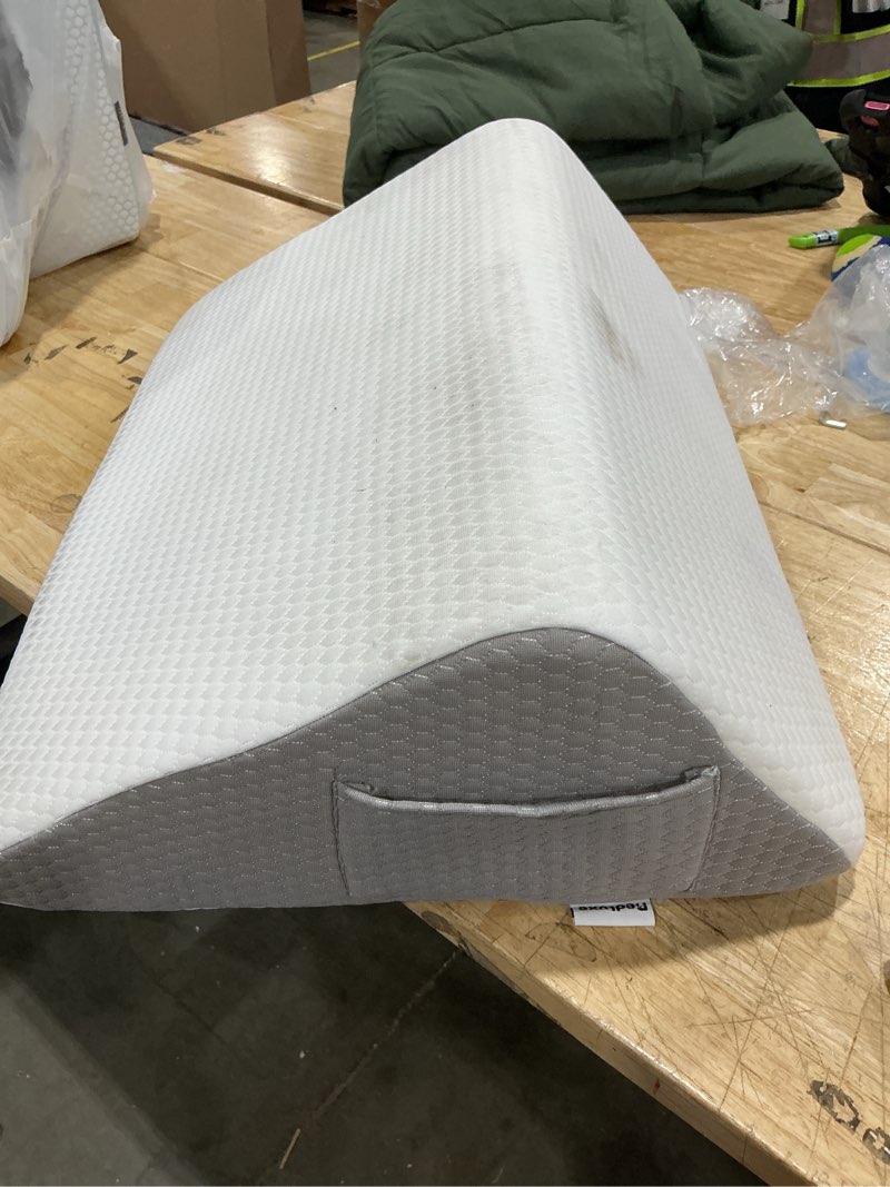 Condition photo showing As Is for adjustable inflatable wedge pillow for back and leg support