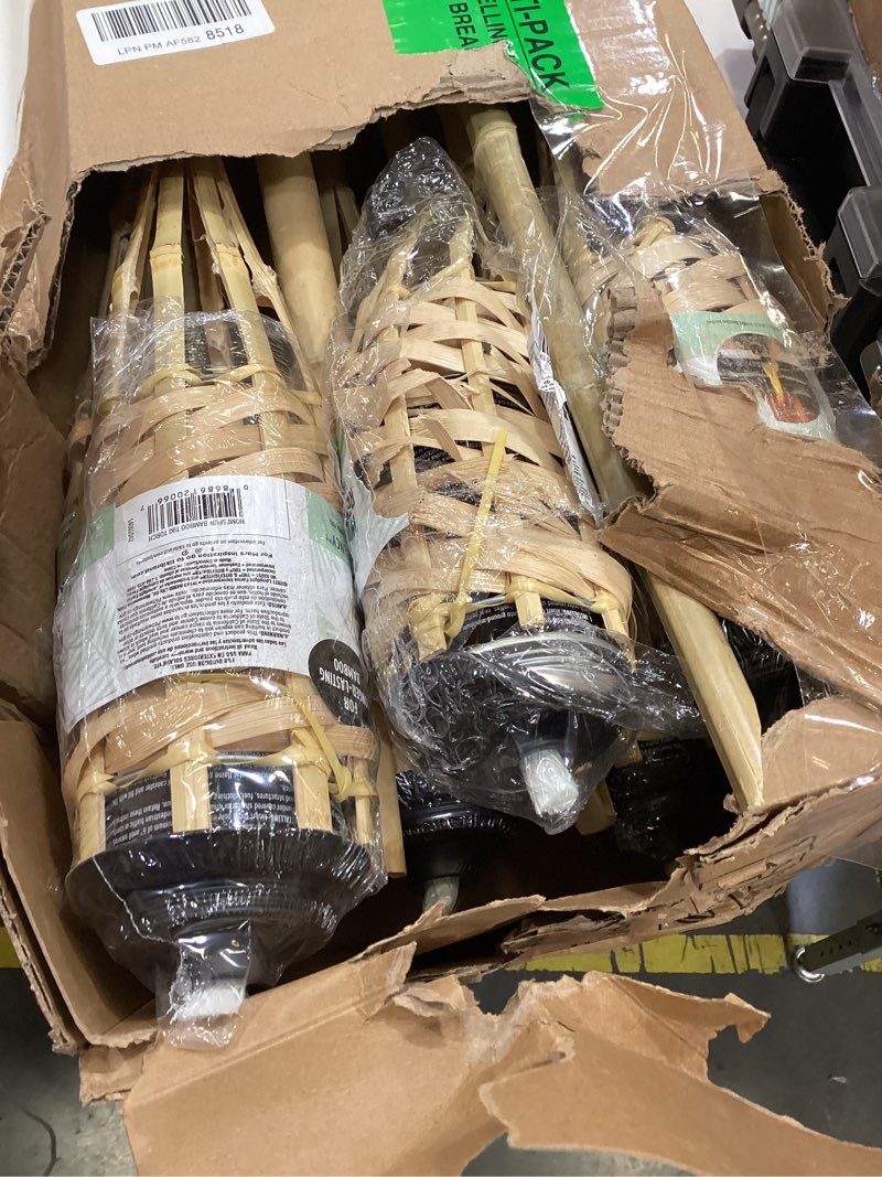 Condition photo showing As Is for tiki brand homespun outdoor torch  natural  pack of 12
