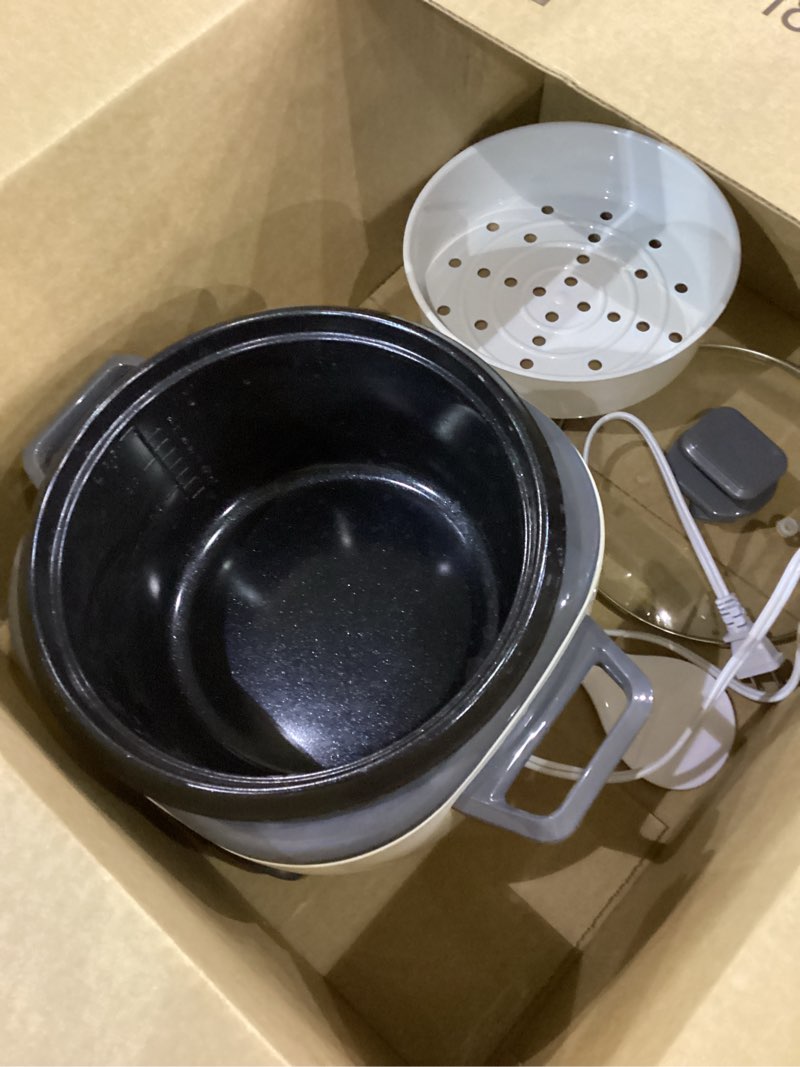 Condition photo showing As Is for BLACK+DECKER Rice Cooker 6-Cup (Cooked) with Steaming Basket, Removable Non-Stick Bowl, White 6-cup rice cooker