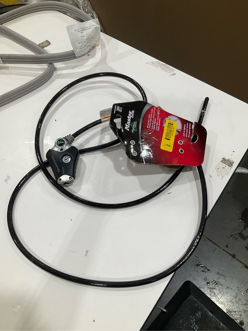 Condition photo showing As Is for incomplete, missing keys, master lock cable lock