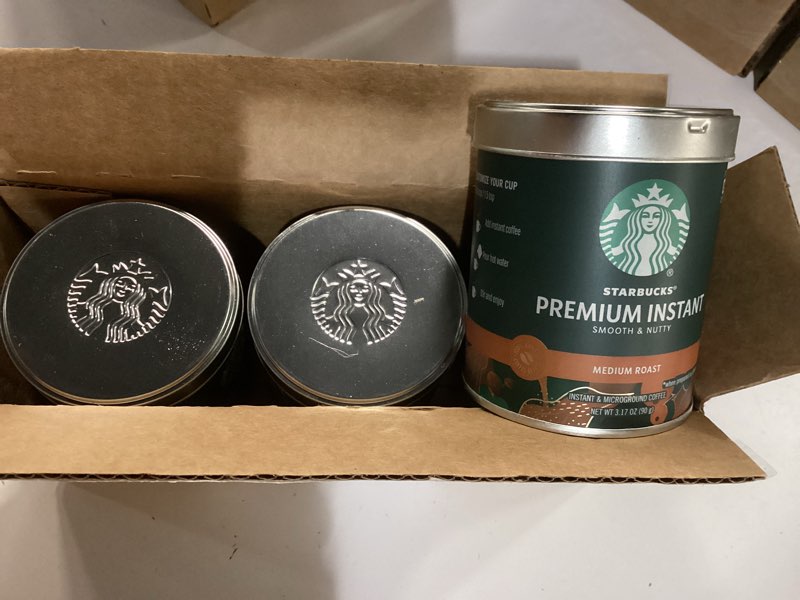 Condition photo showing New/Like New for starbucks premium instant coffee, medium roast coffee, arabica beans, three 3.17 oz tins