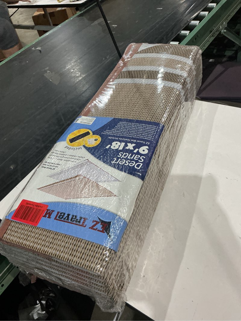 Condition photo showing New/Like New for reversible rv outdoor rug for backyards, beaches, camping grounds, patios, and more, storage bag and mat stakes included, beige/white (9x18)