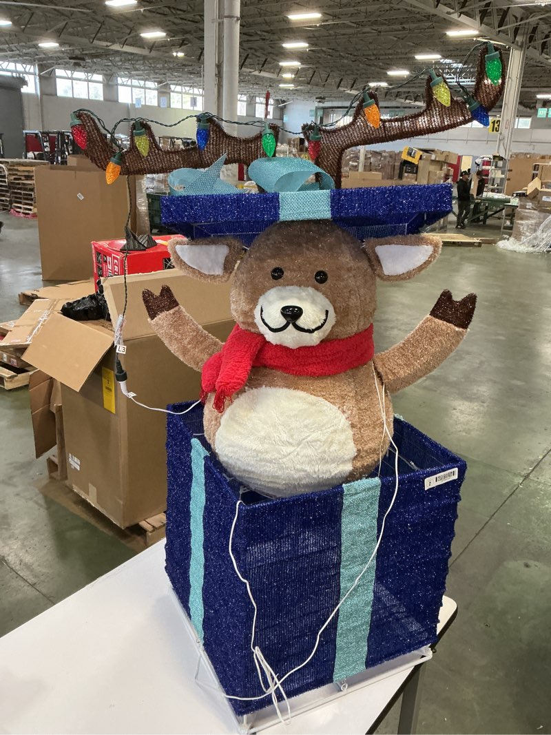 Condition photo showing As Is for  Holiday Living 4-ft Animatronic LED Reindeer in Giftbox Yard Decoration