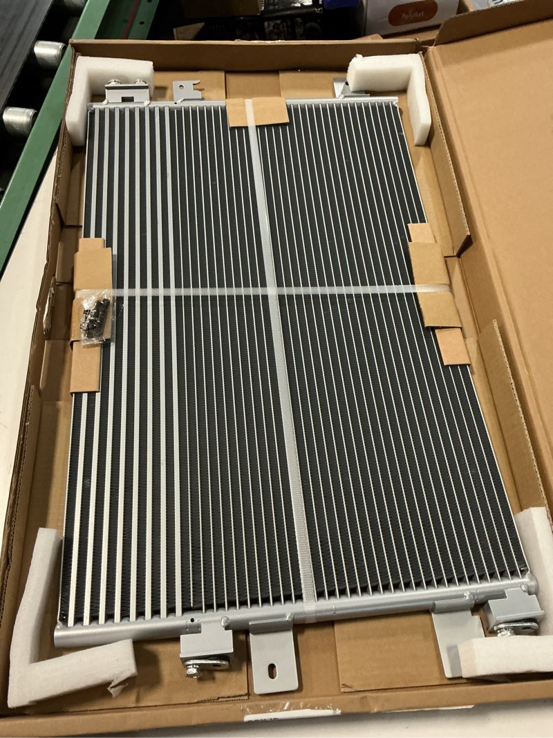 Condition photo showing New/Like New for tyc 3586 condenser assembly compatible with 2011-2014 chrysler 200