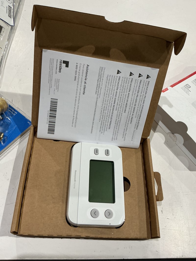 Condition photo showing As Is for honeywell thermostat, digital non-programmable thermostat, white