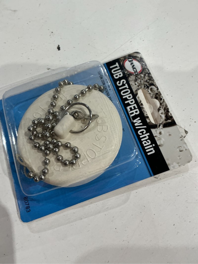 Condition photo showing As Is for 1-1/2 in. - 2 in. universal tub stopper with chain