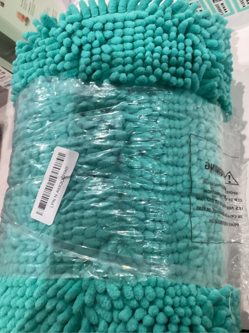 Condition photo showing Good Condition for OLANLY Bathroom Rugs 59x24, Extra Soft Absorbent Chenille Bath Rugs, Rubber Backing Quick Dry, Machine Washable Bath Mats for Bathroom Floor, Tub and Shower, Home Decor Accessories, Teal 59" x 24" Teal