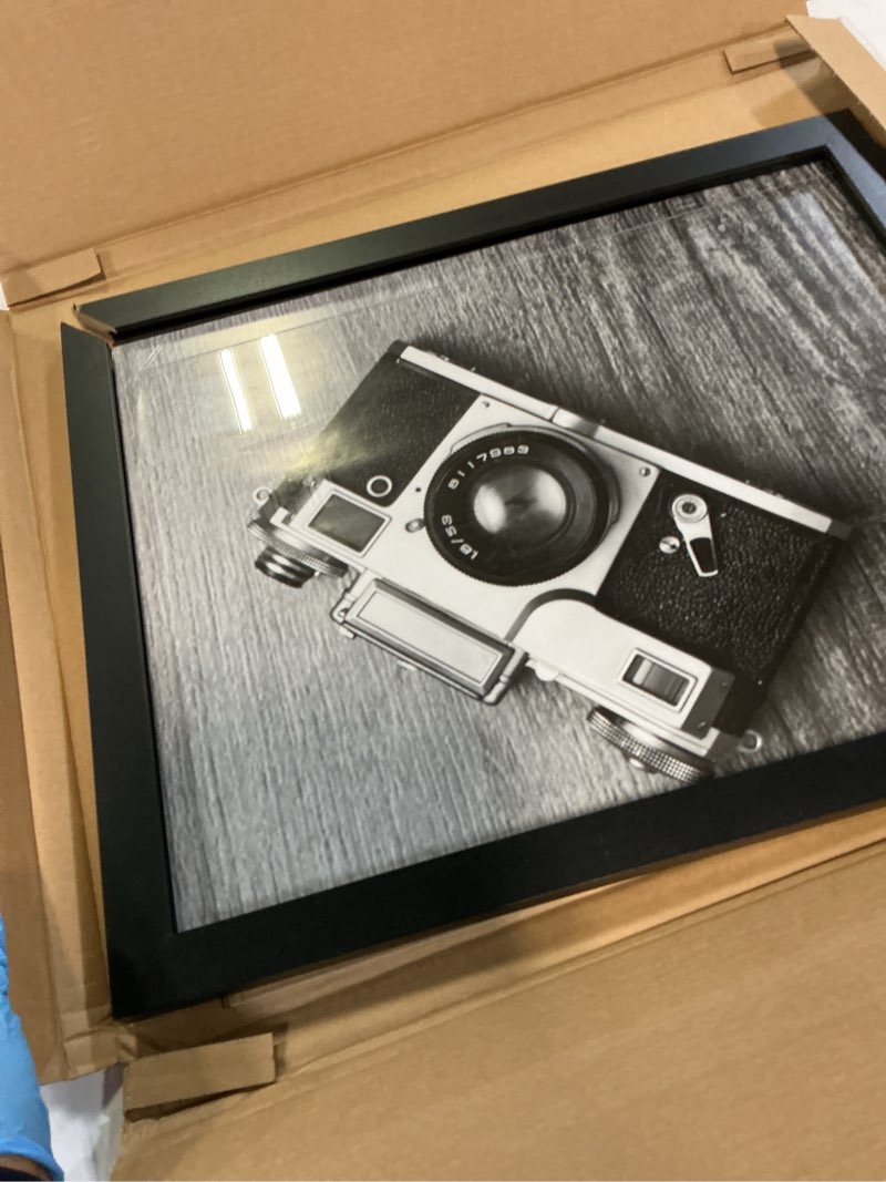 Condition photo showing As Is for Americanflat 16x20 Picture Frame with Polished Plexiglass - Black Picture Frame - Wide Photo Frames Made of Engineered Wood for Vertical or Horizontal Wall Display - Epic Collection - Black Black 16x20