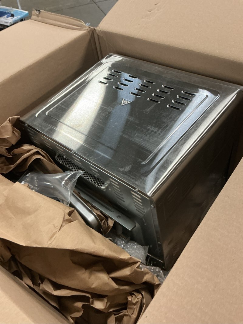 Condition photo showing As Is for dan - emeril lagasse extra large french door air fryer toaster oven combo, 24 cooking functions and digital controls, 7 accessories included, stainless steel finish, 26qt capacity