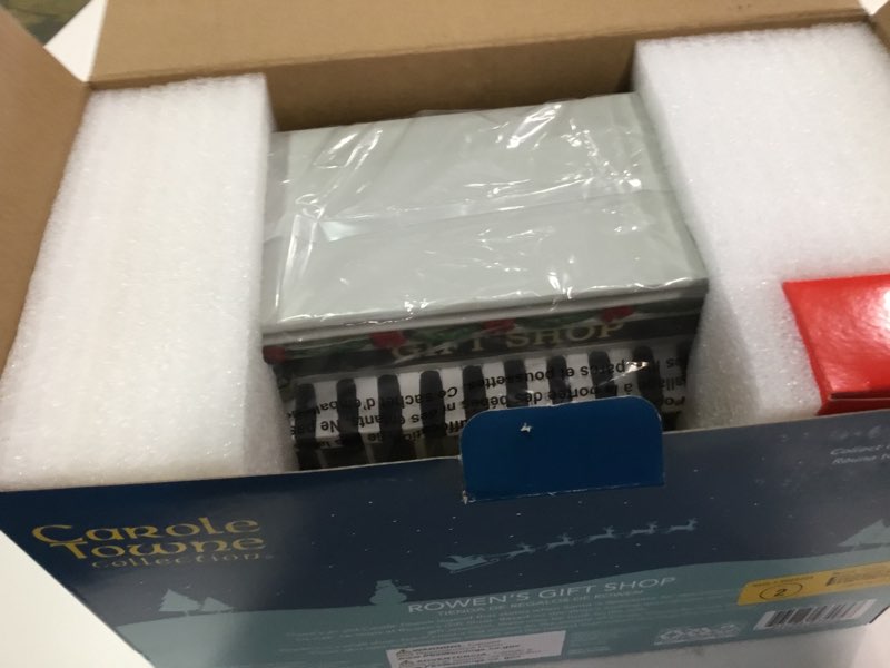Condition photo showing New/Like New for Rowen's Gift Shop LED Lighted Musical Christmas Village Building, 2025