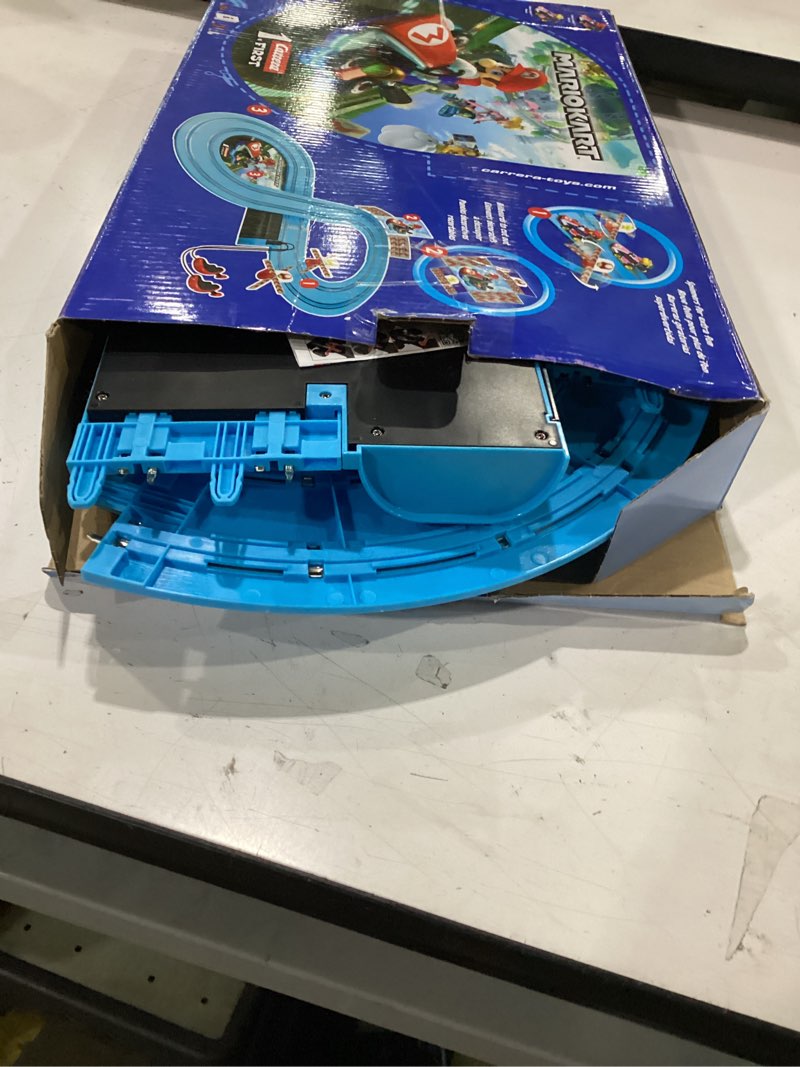 Condition photo showing As Is for carrera first mario kart - slot car race track with spinners - includes 2 cars: mario and peach - battery-powered beginner racing set for kids ages 3 years and up