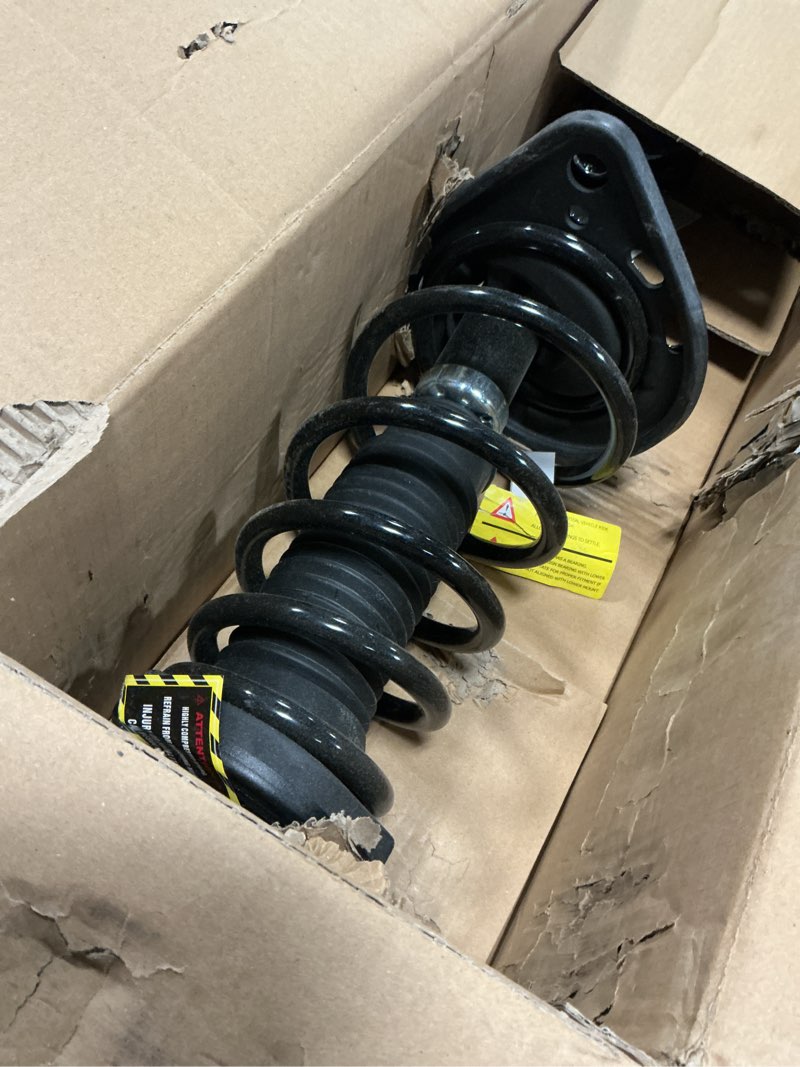 Condition photo showing As Is for TRQ Rear Left Strut and Spring Assembly Compatible with 2013-2018 Toyota Avalon