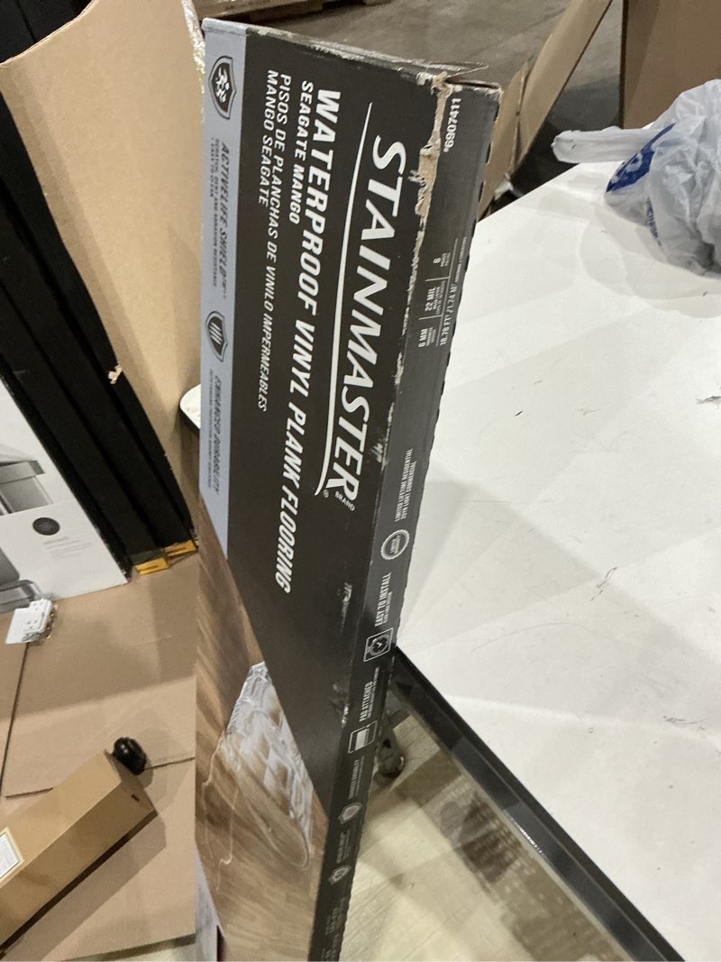 Condition photo showing As Is for stainmaster seagate mango 22-mil x 9-in w x 47-in l waterproof luxury vinyl plank flooring