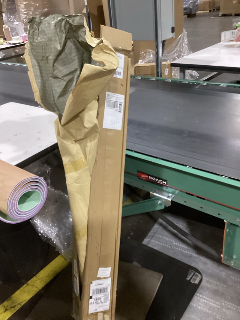 Condition photo showing Good Condition for The image shows a roll of PVC vinyl flooring or linoleum with a wood-grain pattern on one side and a textured backing.  Made of durable, water-resistant PVC material. 
