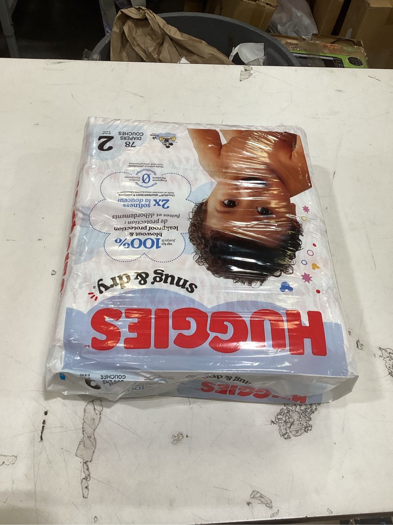 Condition photo showing New/Like New for this image shows a package of huggies snug & dry baby diapers, size 2 (12-18 lbs), 78 count.  