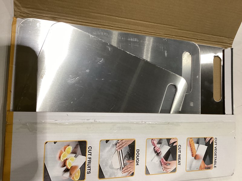 Condition photo showing Good Condition for titanium cutting boards set of 3, 100% pure titanium kitchen cutting board, double-sided non-toxic cutting board, ideal for slicing and dicing meats, features handle, dishwasher safe silver 16"l*10"w(s+m+l)