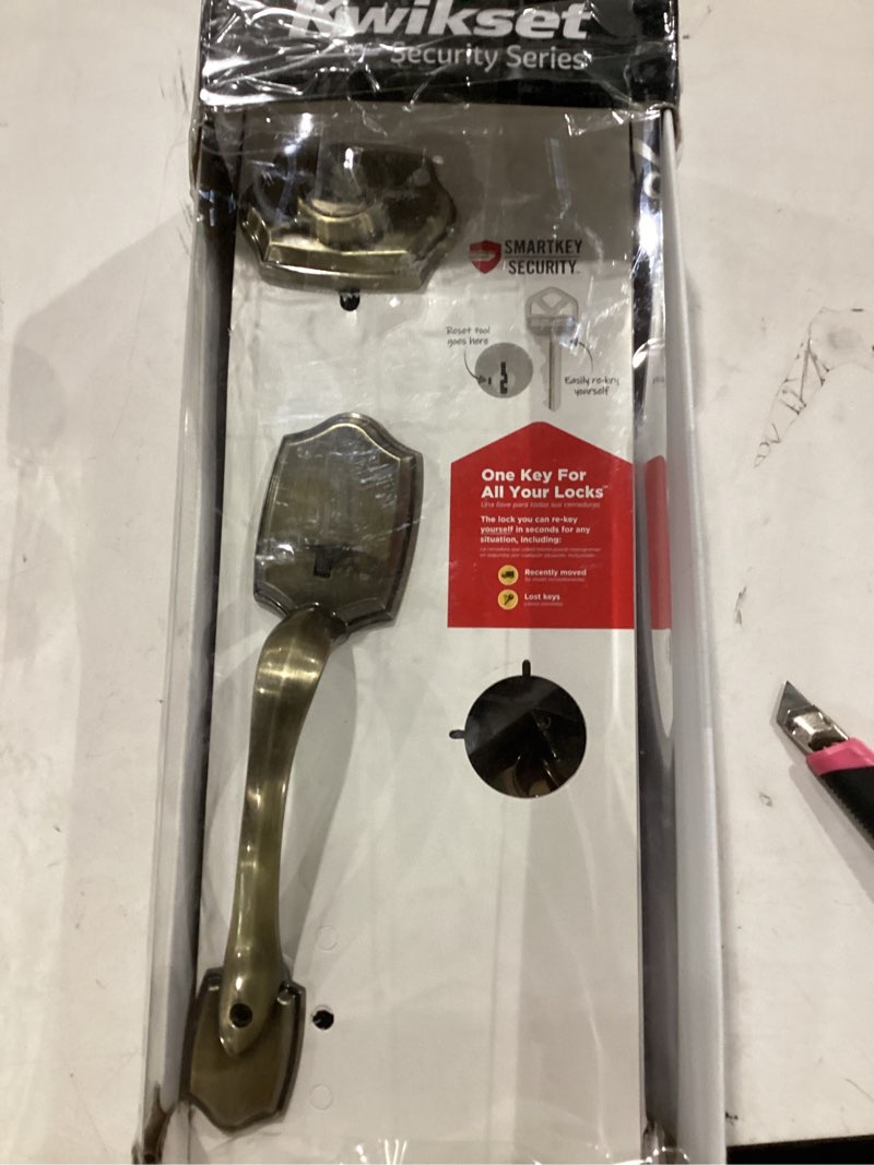 Condition photo showing As Is for kwikset belleview front door lock handle and deadbolt set, entry handleset exterior with interior door knob, antique brass, pick resistant smartkey rekey deadbolt security an tique brass full handleset