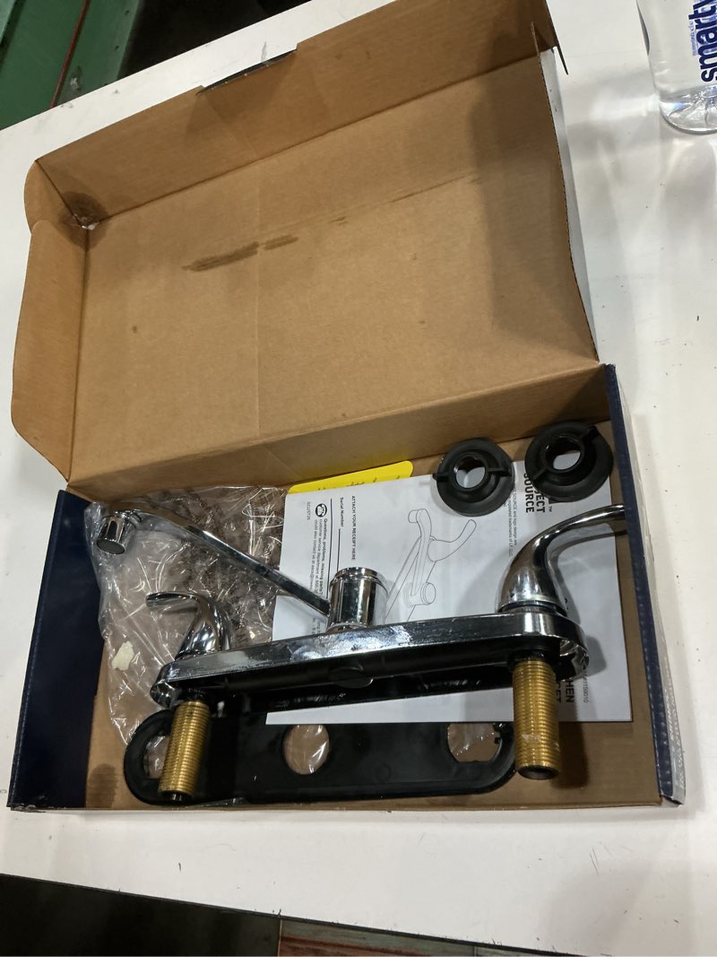 Condition photo showing As Is for project source dover chrome double handle deck-mount kitchen faucet (includes deck plate)