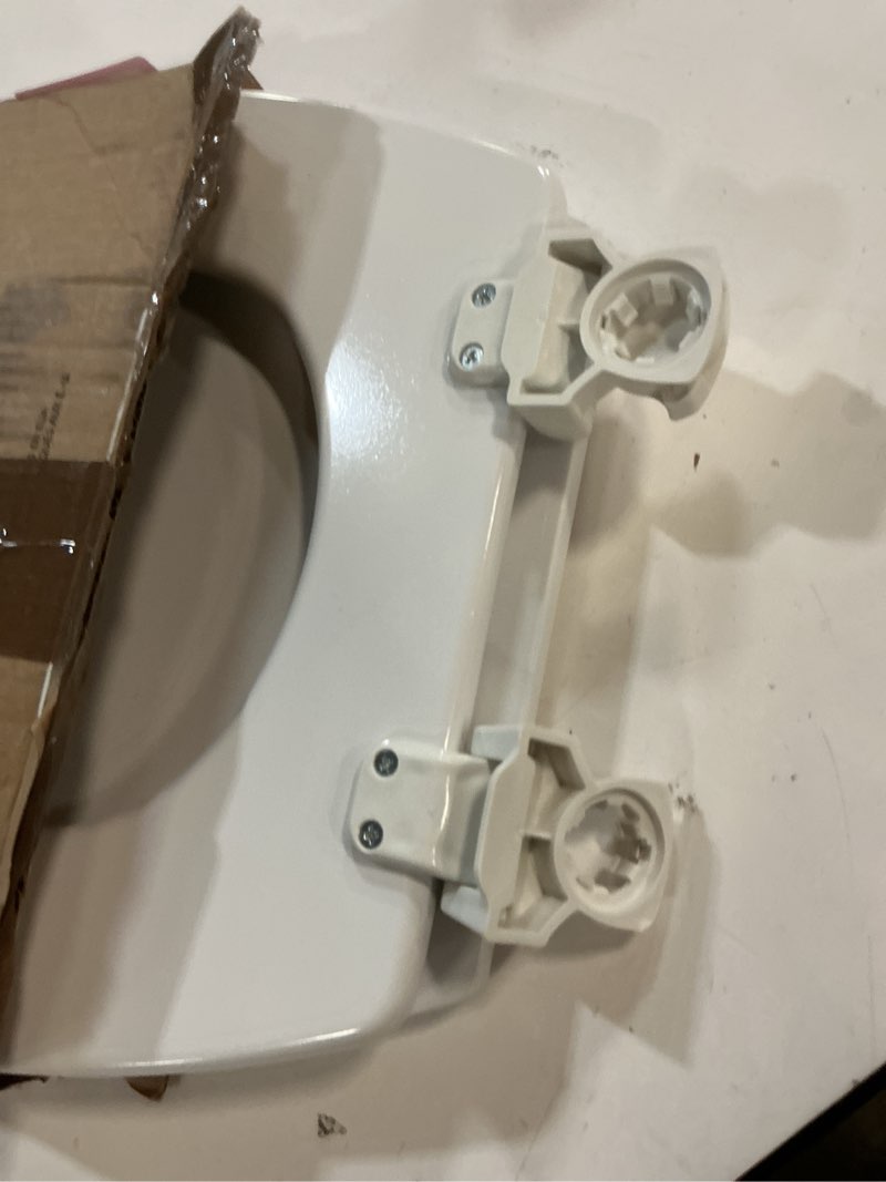 Condition photo showing As Is for bemis round enameled wood toilet seat in cotton white with easy•clean hinge