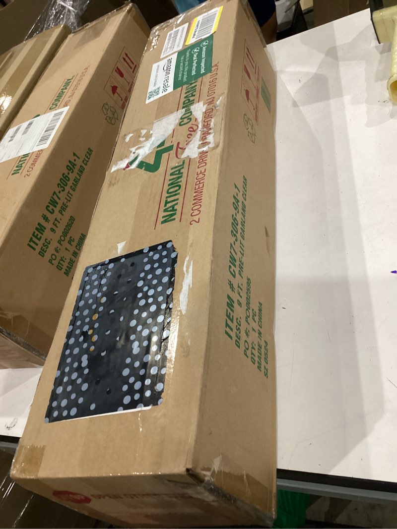 Condition photo showing New/Like New for national tree company 9 ft pre-lit crestwood spruce artificial christmas garland, christmas decoration with glitter, pinecones, red berries, 50 clear lights, 180 tips, green plug in tree