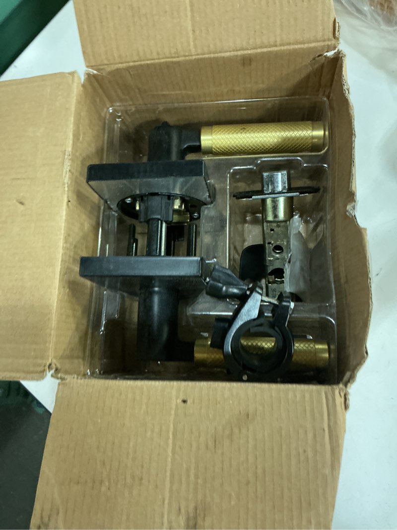 Condition photo showing As Is for kwikset prava entry door handle with lock and key, secure keyed reversible lever exterior, for front entrance and bedrooms, matte black and satin brass, pick resistant smartkey security and microban matte black & satin brass entry