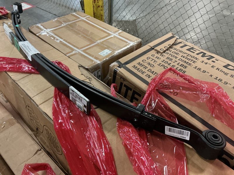 Condition photo showing As Is for dorman 929-115 rear leaf spring compatible with select chevrolet / gmc models