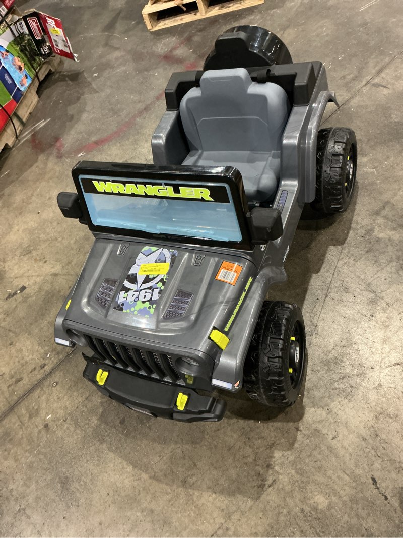 Condition photo showing As Is for 6v power wheels jeep wrangler toddler ride-on toy with driving sounds, multi-terrain traction, gray