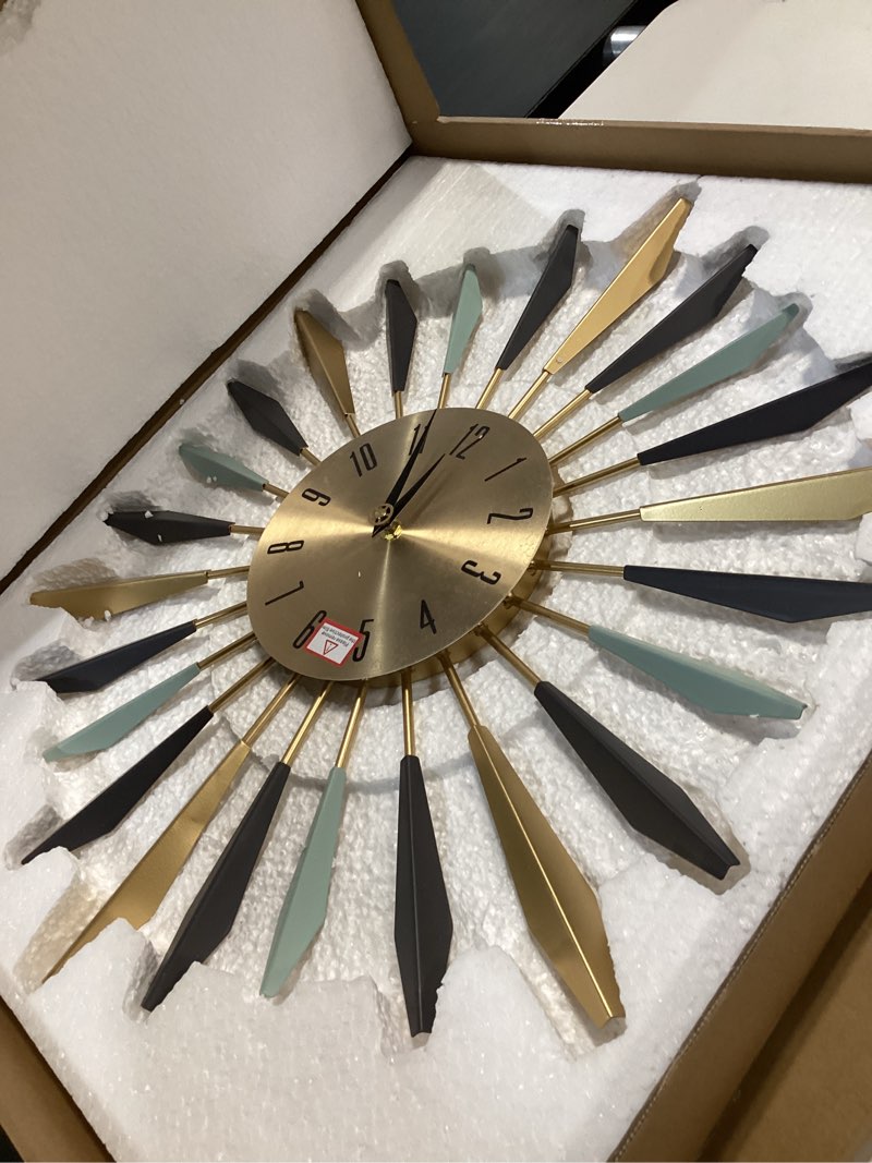 Condition photo showing Good Condition for YISITEONE Large Wall Clock Metal Decorative, Mid Century Silent Non-Ticking Big Clocks, Modern Home Decorations for Living Room,Bedroom,Dining Room, Office, 22 inch Medium 1.modern