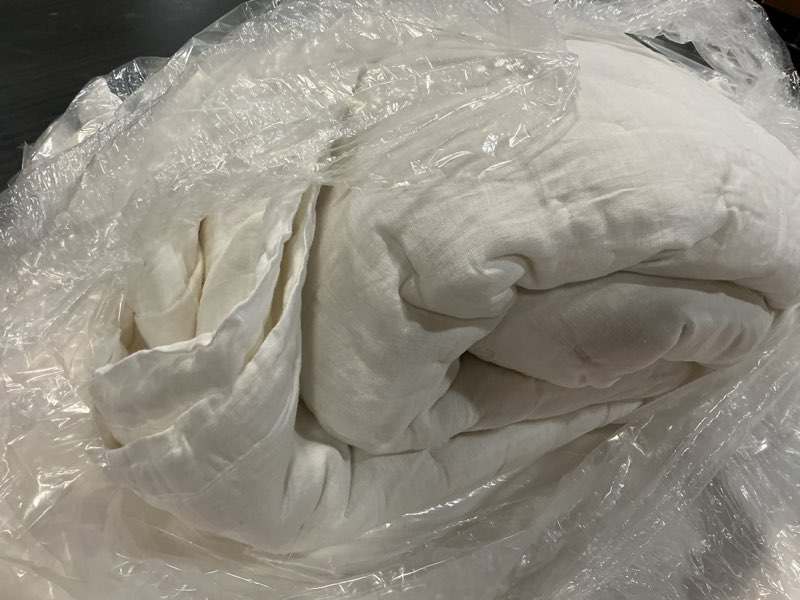 Condition photo showing As Is for european linen dream quilt, full/queen, white