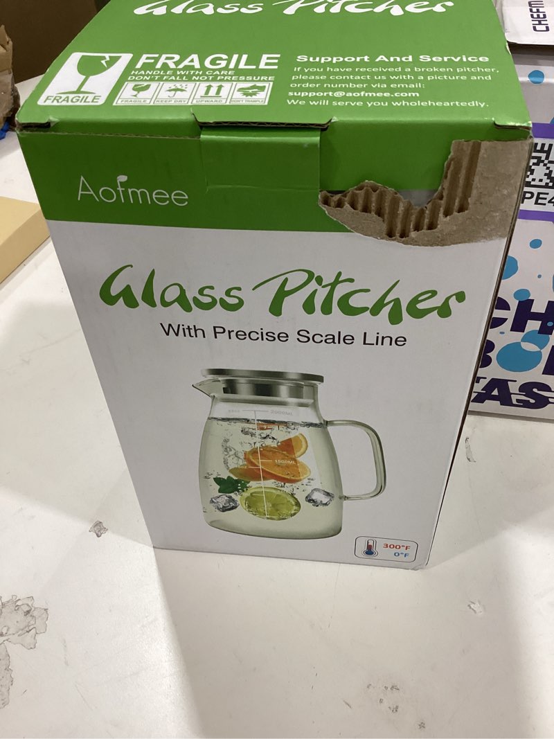 Condition photo showing New/Like New for Aofmee Glass Pitcher with Lid, 68oz Water Pitcher with Handle and Precise Scale Line, Stainless Steel Iced Tea Carafe, Heat Resistant Borosilicate Jug for Juice, Milk, Cold or Hot Beverages 68 OZ