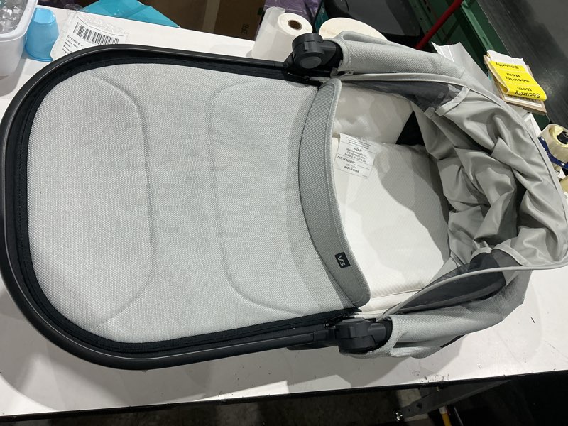 Condition photo showing As Is for uppababy bassinet v3 - compatible with vista, cruz, ridge strollers - overnight sleep solution - mattress, sheet and bug shield included - savannah (pearl gray jacquard/carbon frame)