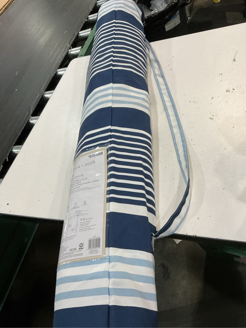 Condition photo showing As Is for allen + roth 9-ft aluminum blue auto-tilt market patio umbrella