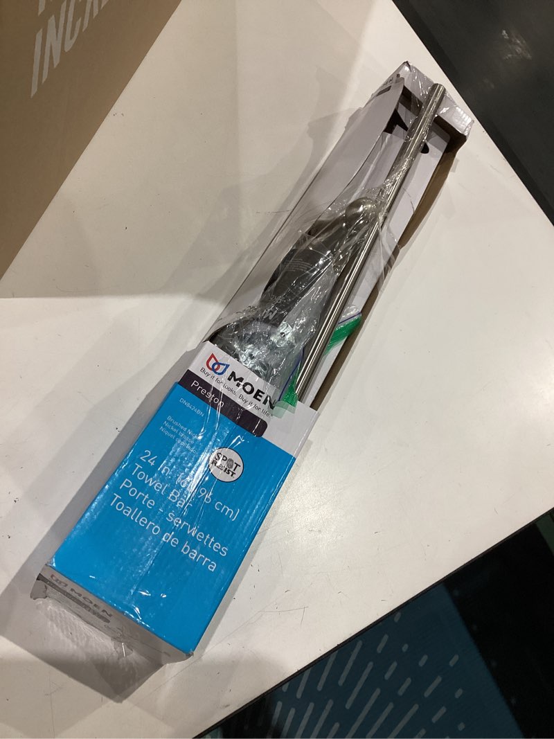 Condition photo showing As Is for moen preston brushed nickel 24-inch single wall mounted bathroom towel bar, dn8424bn