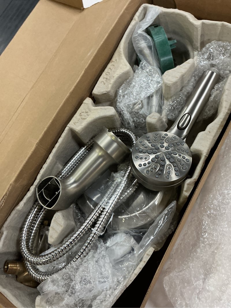 Condition photo showing As Is for moen engage multi-function handshower and rainfall shower head trim combo with handle, tub spout, metal hose and valve, brushed nickel, 82304srn
