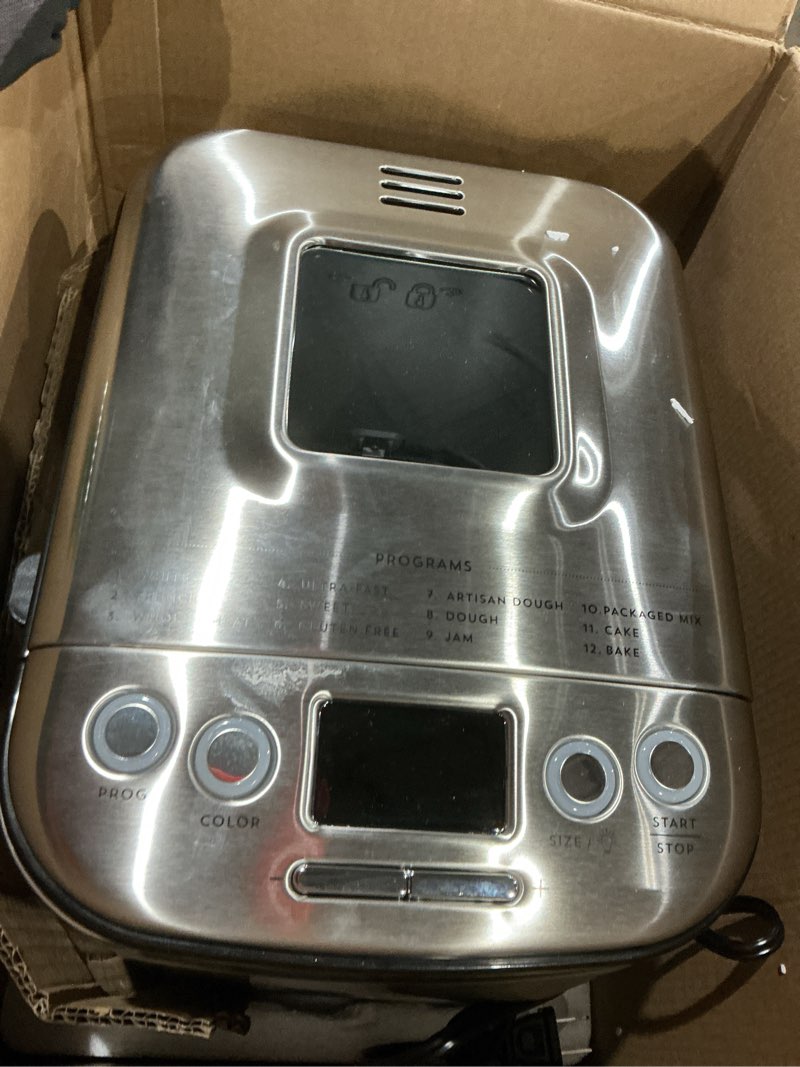 Condition photo showing As Is for cuisinart bread maker machine, stainless steel automatic bread machine with 12 menu options, 3 loaf sizes up to 2 lb., 3 crust colors, removable nonstick baking pan & kneading paddle, cbk-110nas