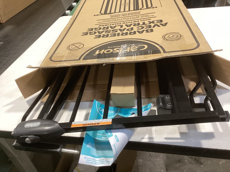 Condition photo showing As Is for Carlson Extra Wide Walk Through Pet Gate with Small Pet Door, Includes 4-Inch Extension Kit, Pressure Mount Kit and Wall Mount Kit, Black