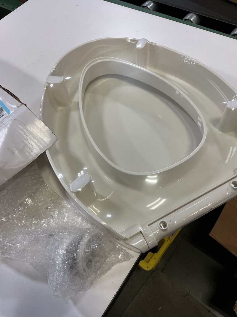 Condition photo showing Good Condition for kohler 25875-96 hyten 3" height, elevated soft close elongated toilet seat, contoured seat with grip-tight bumpers, quick-attach hardware, no slam toilet seat, biscuit biscuit elongated