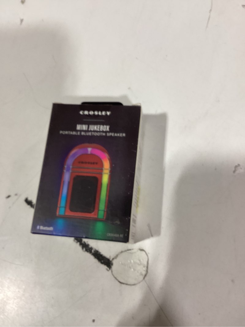 Condition photo showing New/Like New for Crosley CR3046A-RE Mini Jukebox Portable Bluetooth Speaker with LED Lights and Microphone, Red