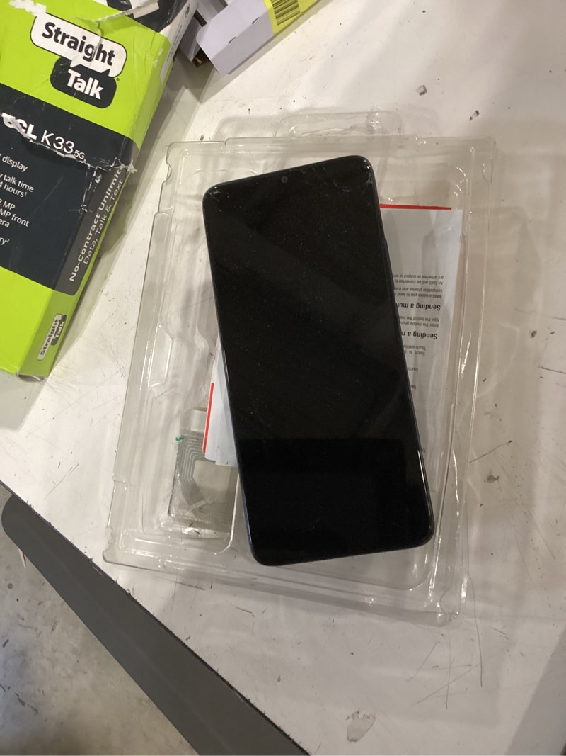 Condition photo showing As Is for verizon prepaid tcl k33, 5g, 64gb, space gray - prepaid smartphone [locked to verizon prepaid]