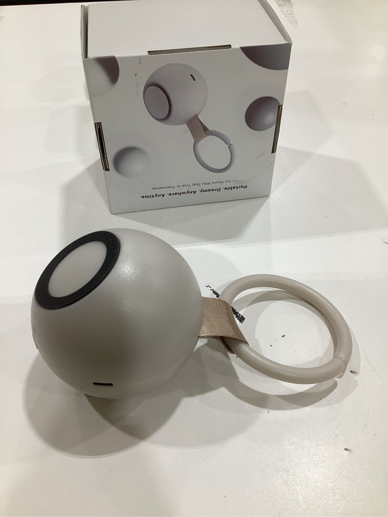 Condition photo showing Good Condition for 2026 mom's choice awards, portable sound machine for baby adult, ai cry detection, 18 soothing sound, bluetooth rechargeable white noise machine for home office travel, nursery light, gray putty gray