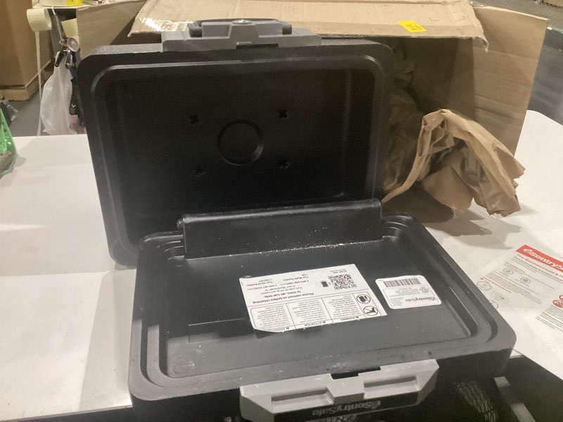 Condition photo showing As Is for sentrysafe fireproof safe box with key lock, chest safe with carrying handle to secure money, jewelry, documents, 0.25 cubic feet, 6.3 x 15.3 x 12.1 inches, 1160 fire resistant box 0.25 cu. ft.
