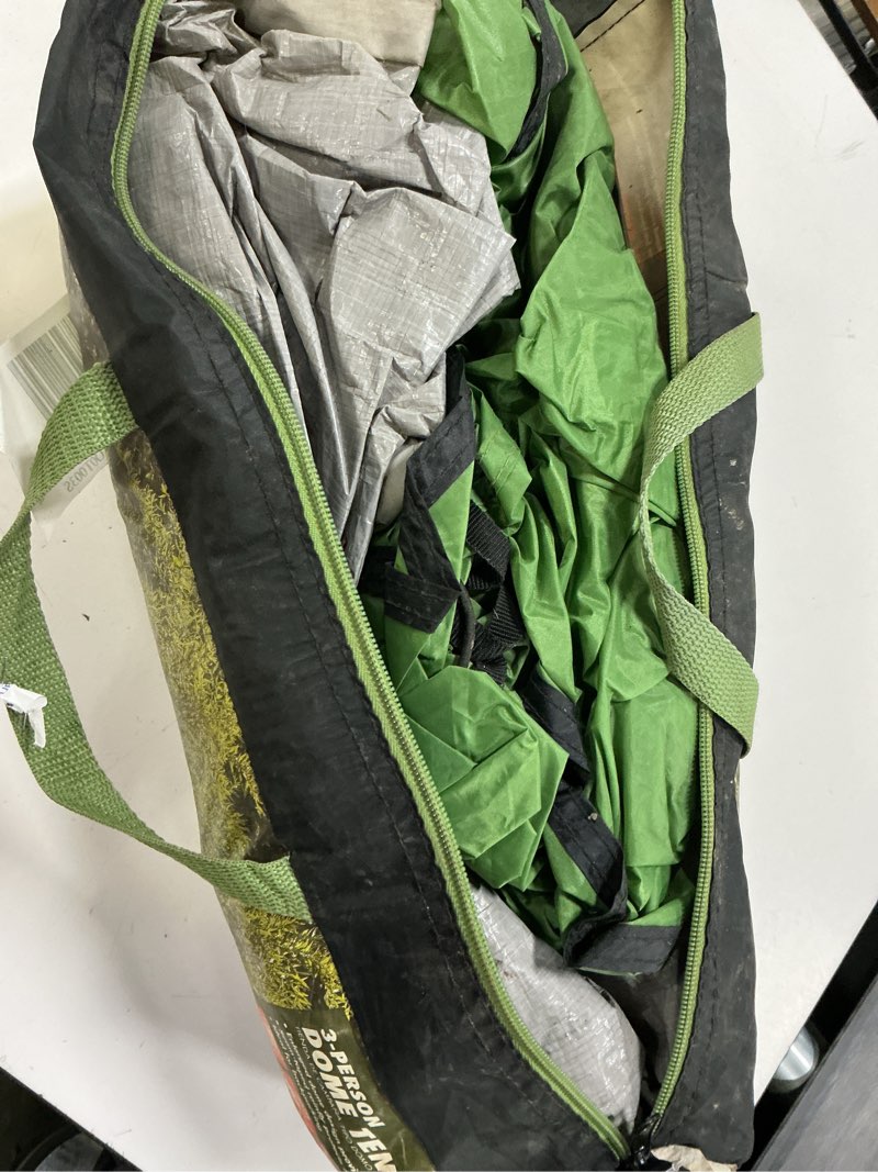 Condition photo showing As Is for (damaged) ozark trail, 3-person clip & camp dome tent