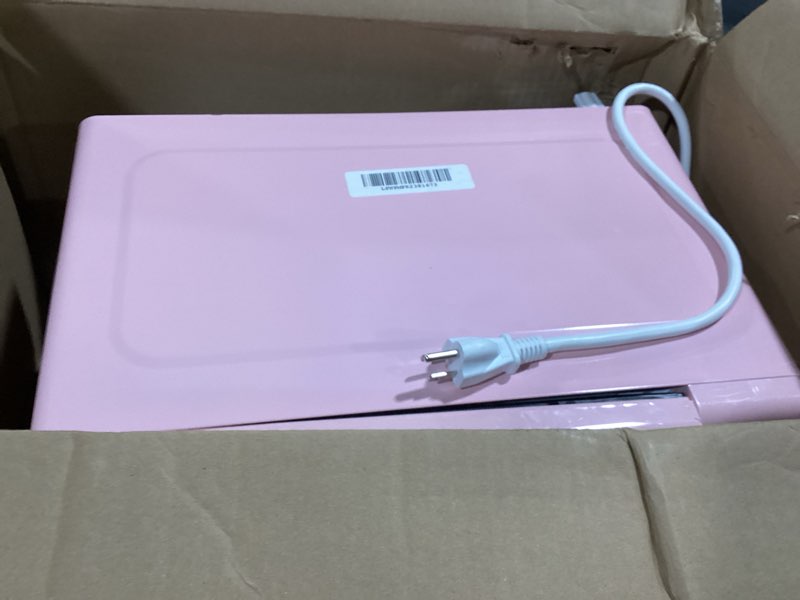 Condition photo showing As Is for Nostalgia Retro Compact Countertop Microwave Oven - 0.7 Cu. Ft. - 700-Watts with LED Digital Display - Child Lock - Easy Clean Interior - Pink Retro Classic 0.7 Cu. Ft. Pink