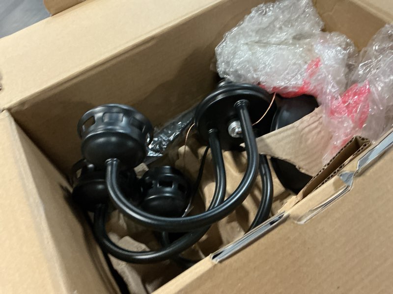 Condition photo showing As Is for project source fallsbrook 3 -light matte black traditional for use in bedrooms, dining rooms, foyers, kitchens, living rooms chandelier