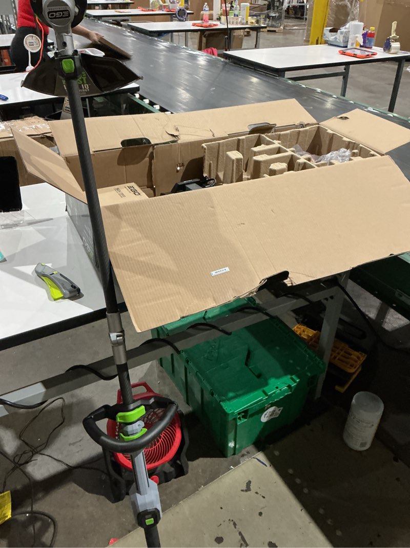 Condition photo showing As Is for ego power+ line iq with powerload st1623t 16 in. 56 v battery string trimmer kit (battery & charger) w/ telescopic shaft & 4.0 ah battery