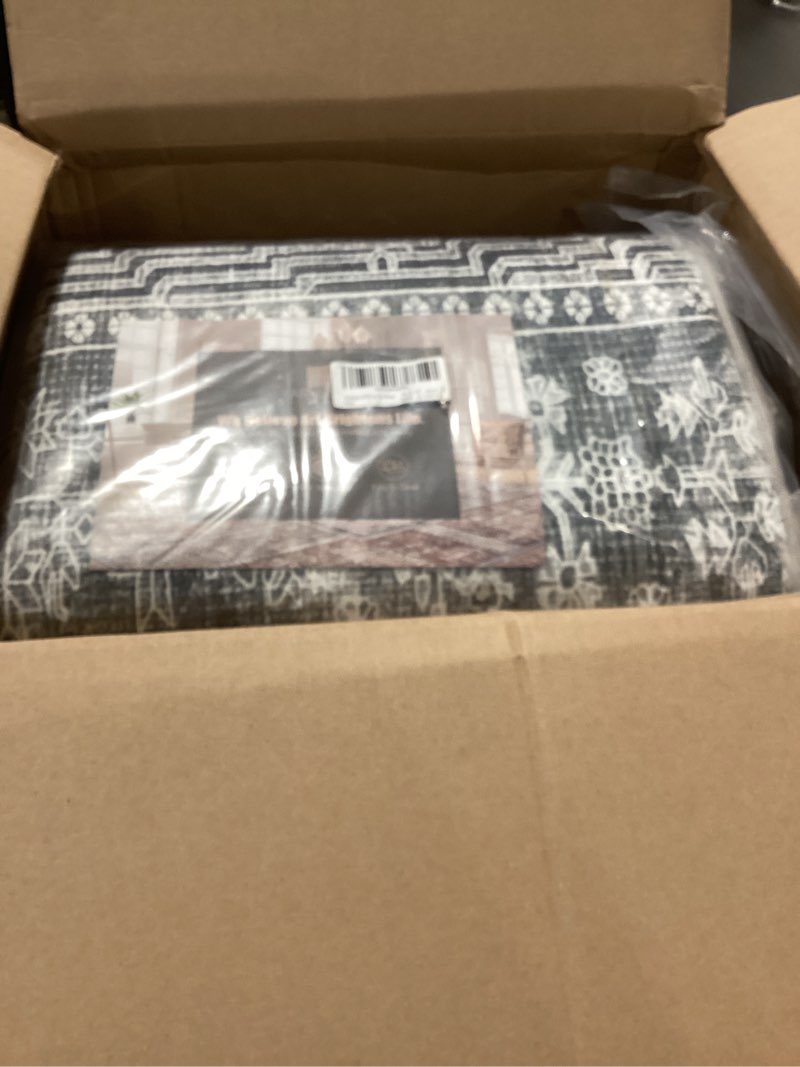 Condition photo showing As Is for Vintage 8' x 10' Washable Area Rug - Stylish Indoor Rug for Living, Dining or Bedroom - Lightweight Carpet with Non-Slip Backing - Foldable for Easy Placement and Maintenance - Grey 8' x 10' (Rectangular) Vintage-grey