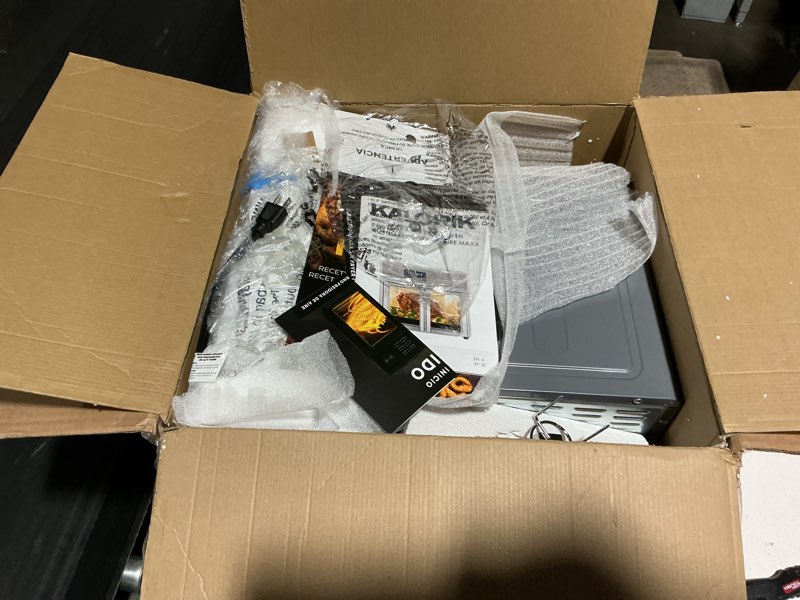 Condition photo showing As Is for kalorik maxx air fryer oven, 26 quart 10-in-1 countertop toaster oven & air fryer combo - fry, bake, roast, rotisserie, & more, large glass french doors & 9 accessories, 1700-watts, stainless steel